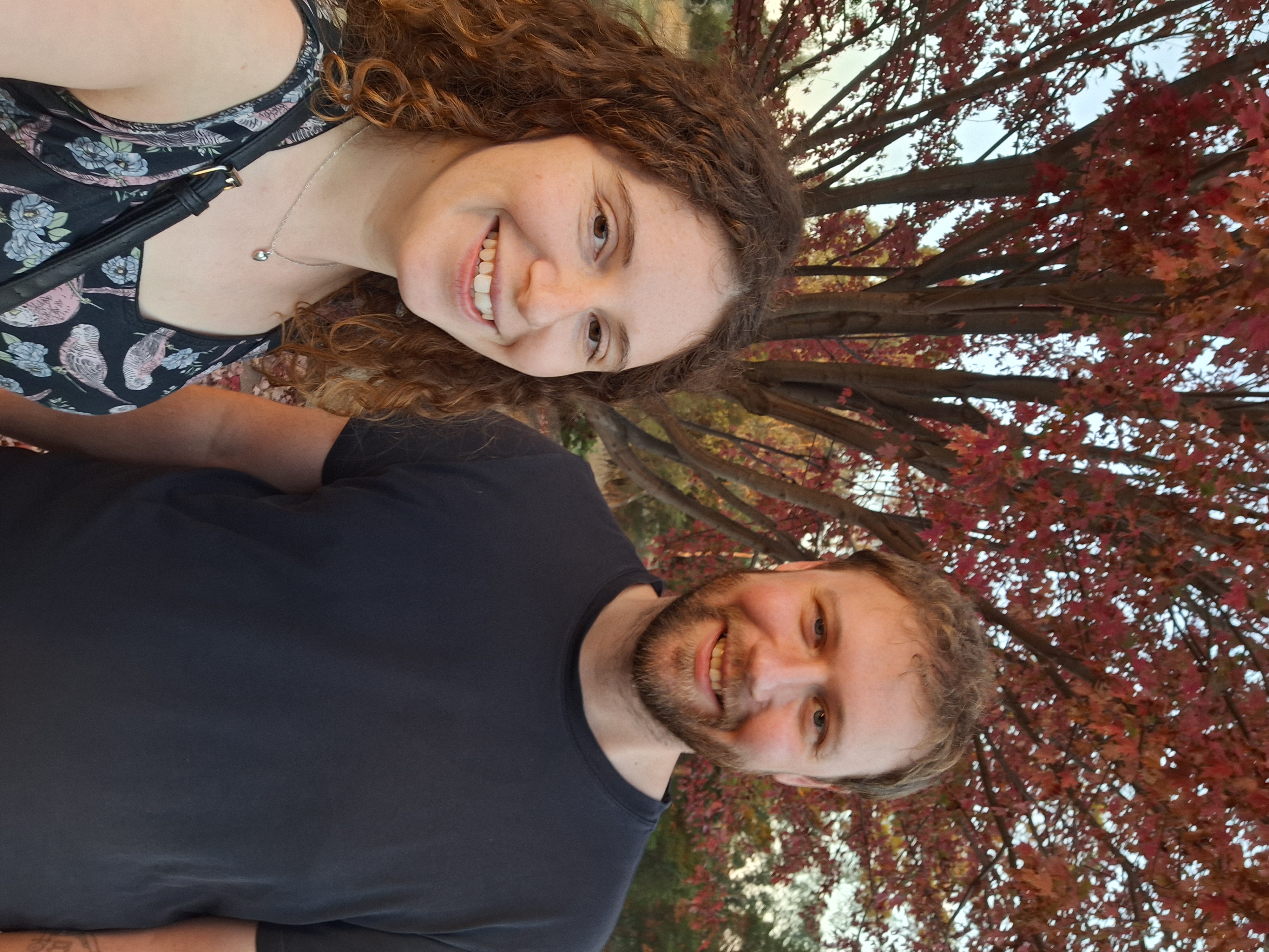 Katelyn and Geoff in Mansfield, with an autumn tree behind them